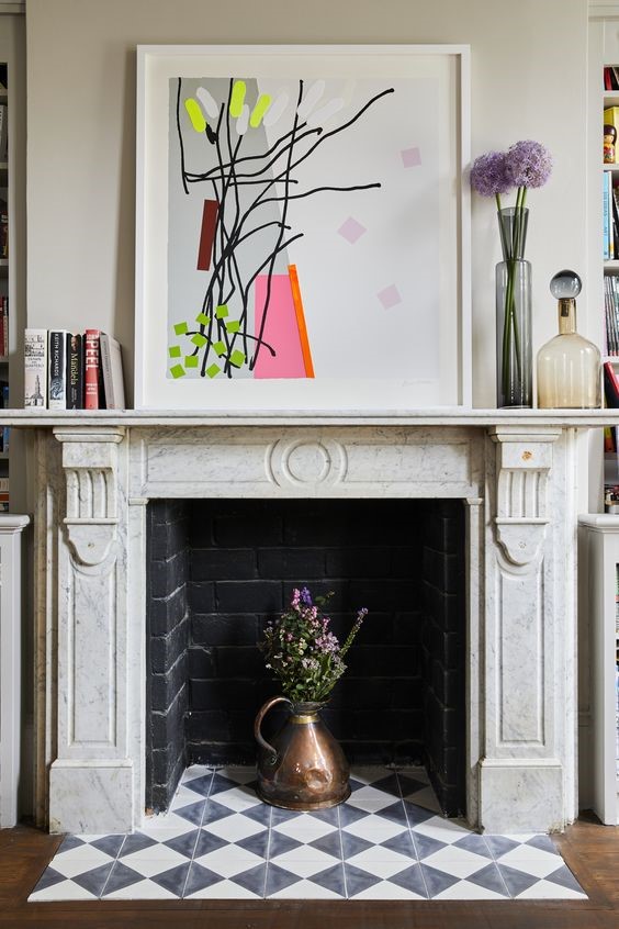white aluminum picture frame on the fireplace decor ideas